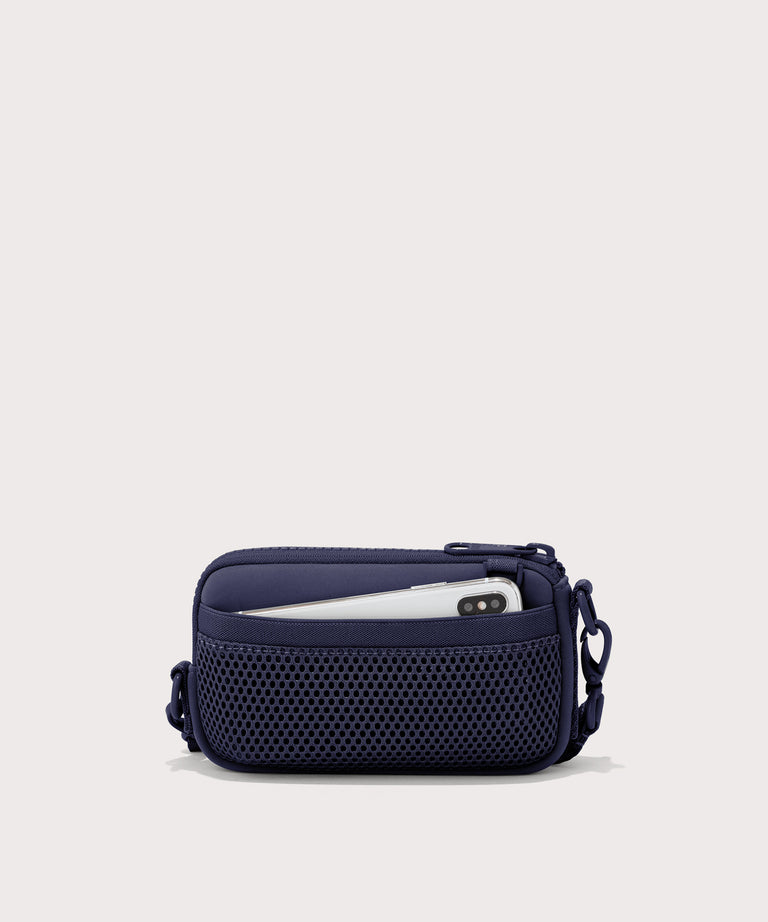 Dagne Dover Mara Phone Sling in dark blue showing the exterior air mesh slip.
