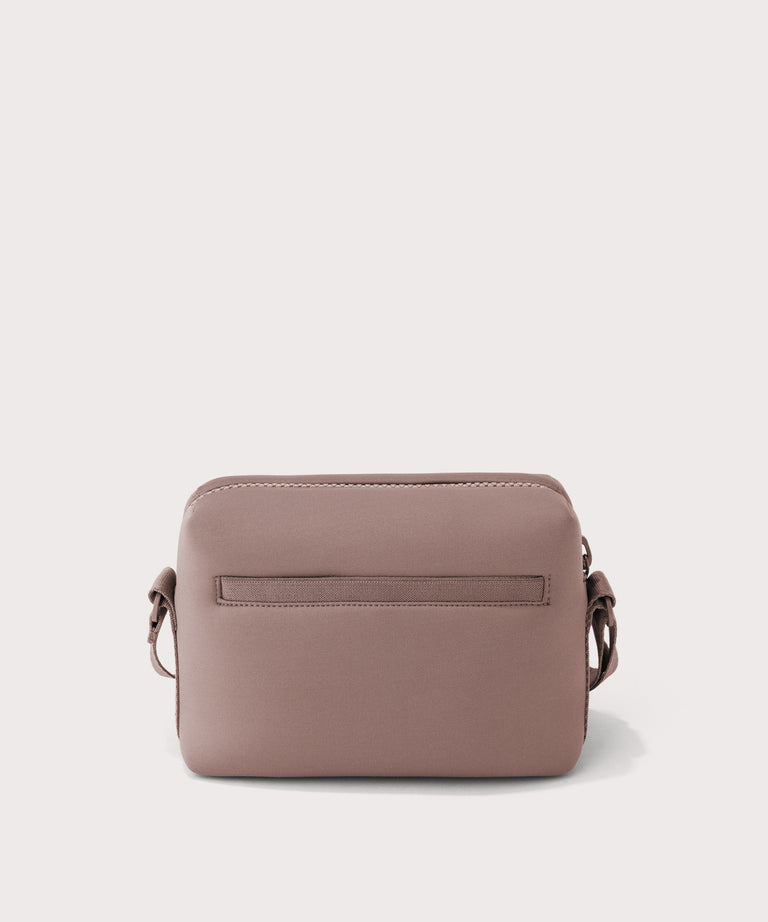 Dagne Dover Micah Crossbody in pink seen from the back.
