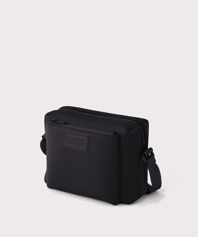 Dagne Dover Micah crossbody in black seen from an angle.
