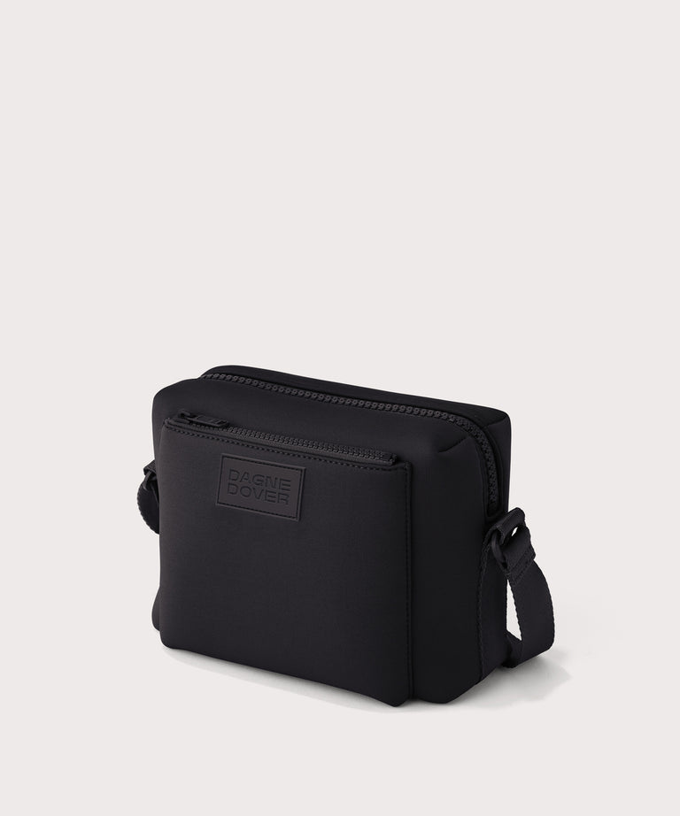Dagne Dover Micah crossbody in black seen from an angle.
