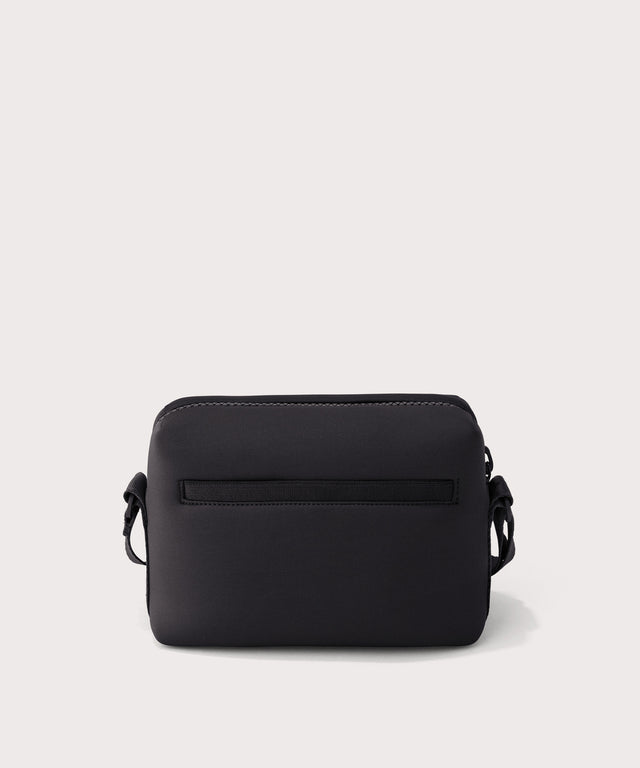 Dagne Dover Micah Crossbody in black seen from the back.
