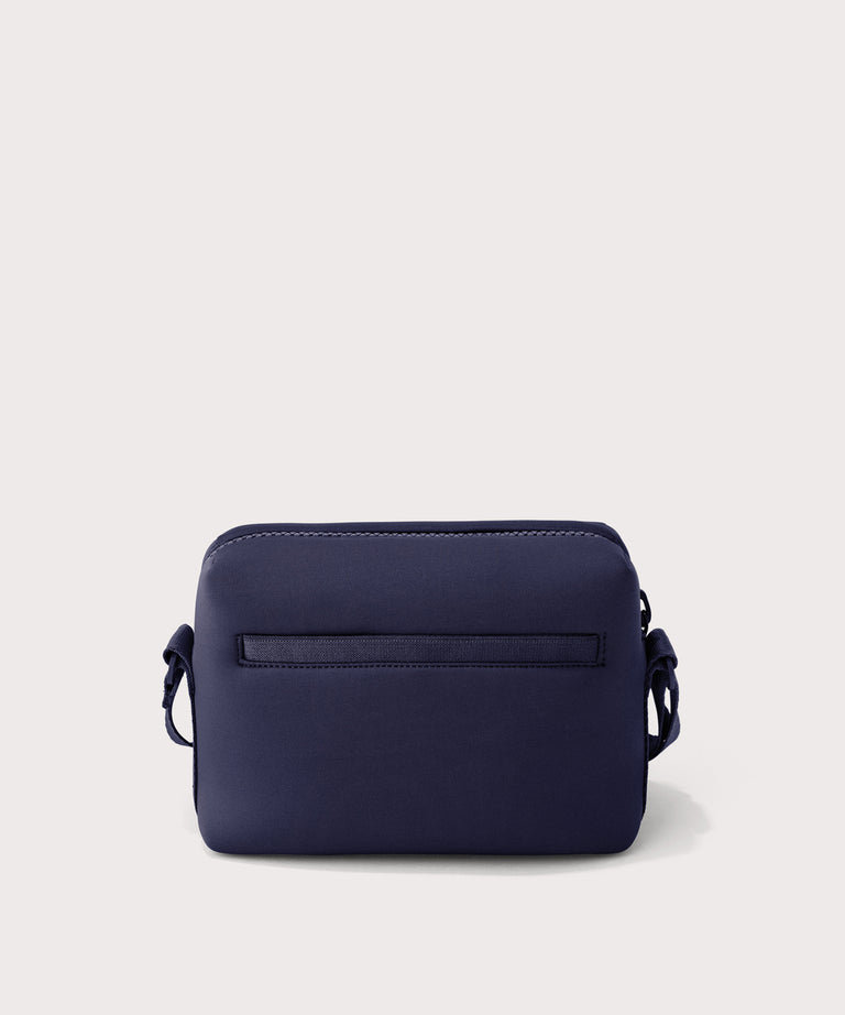 Dagne Dover Micah Crossbody in dark blue seen from the back.
