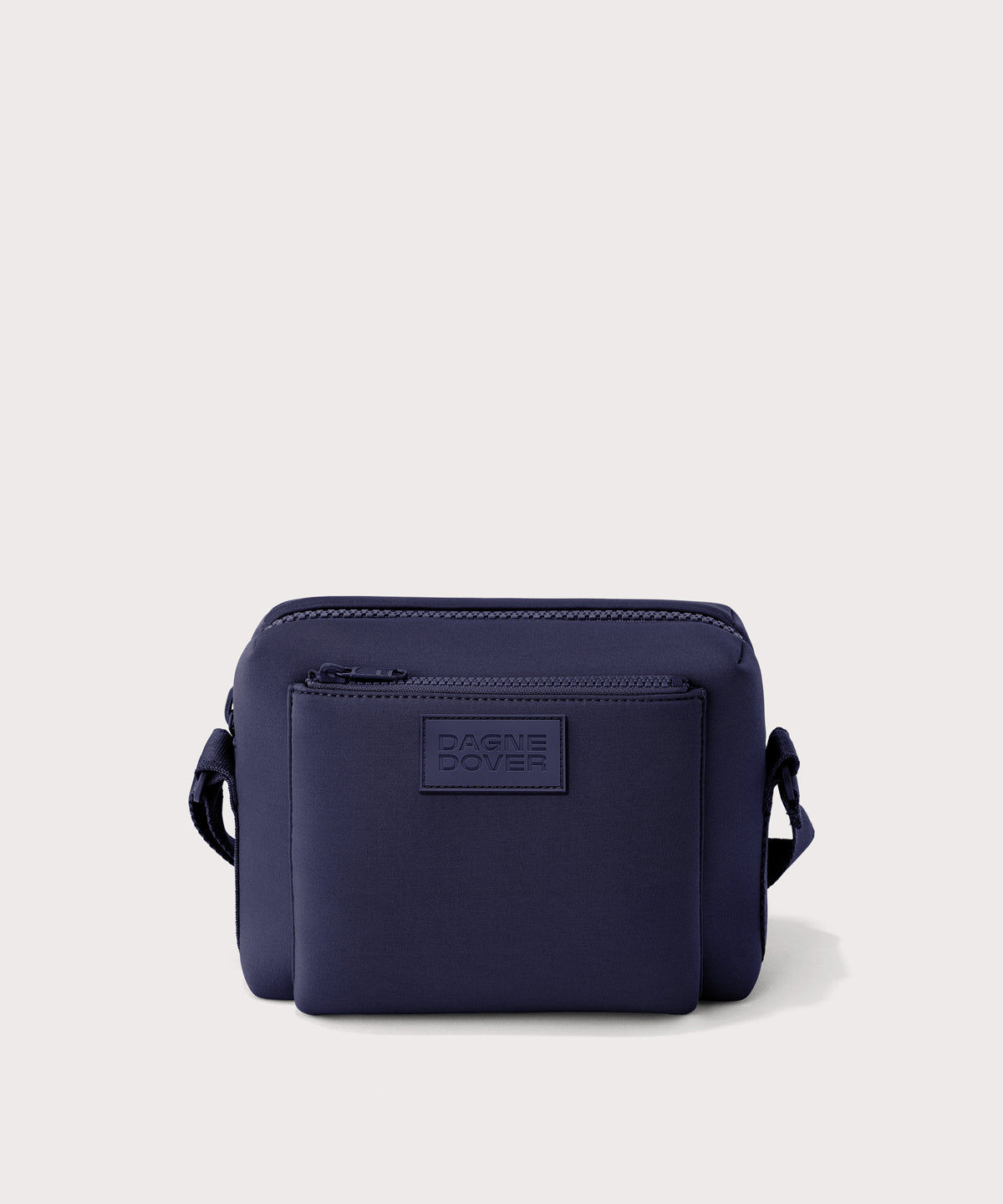 Dagne Dover Micah Crossbody in dark blue seen without the adjustable shoulder strap.
