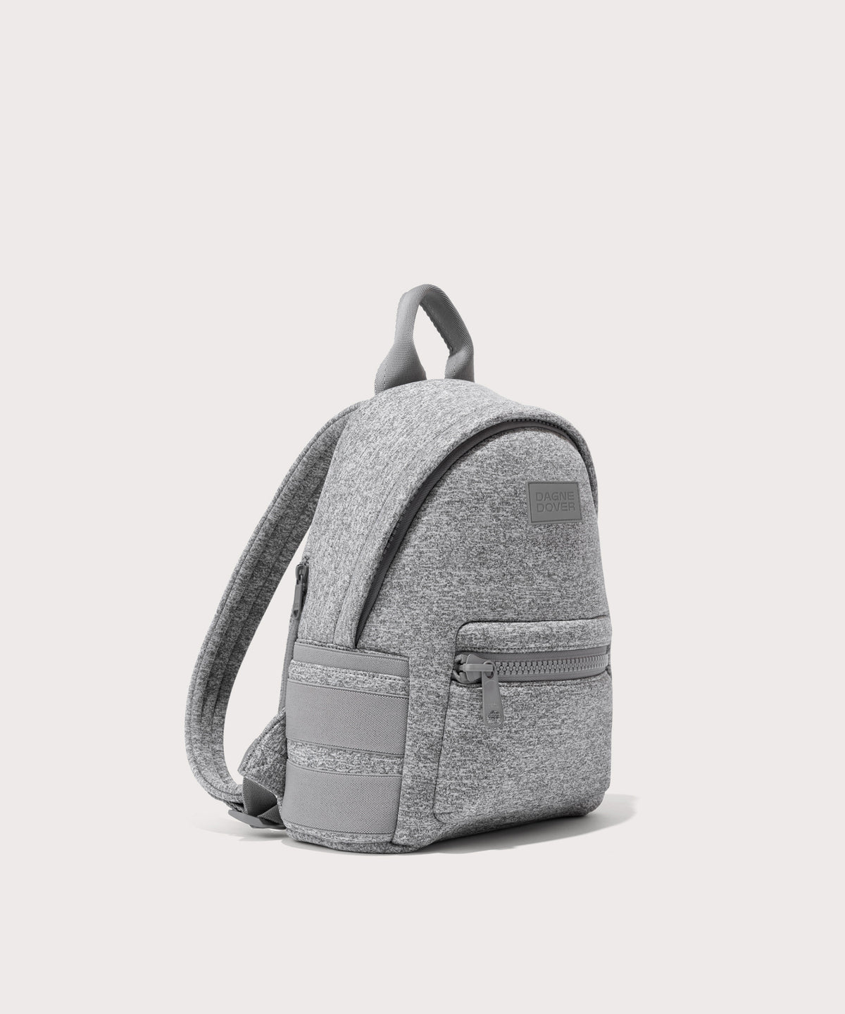 Dagne Dover small Dakota Neoprene Backpack in grey seen from an angle.
