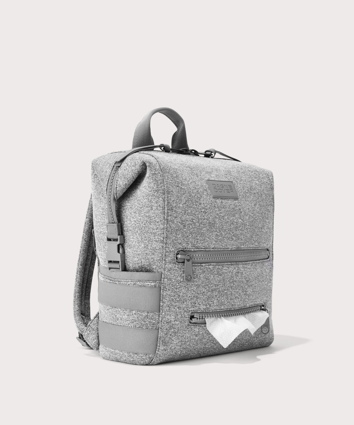 Dagne Dover Medium Indi Diaper Backpack in grey showing the zipper opening for easy access wipes.
