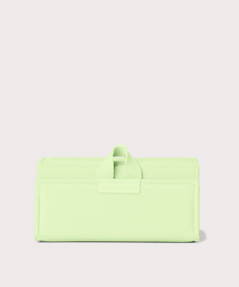Dagne Dover Remi foldable glasses holder in matcha green.
