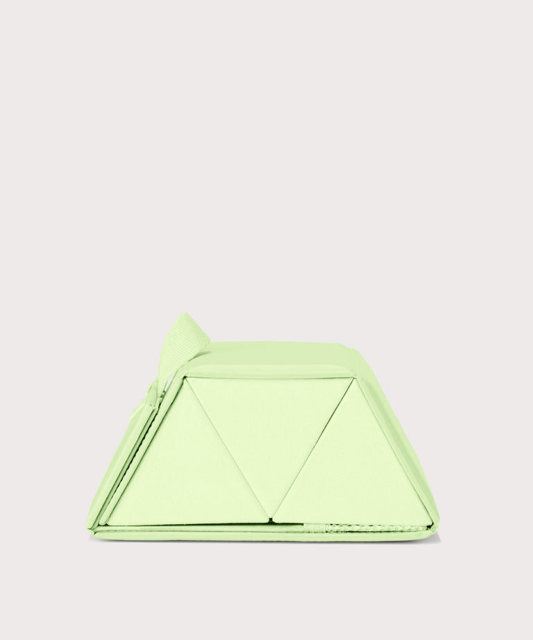 Dagne Dover Remi foldable glasses holder in matcha green seen from the side.
