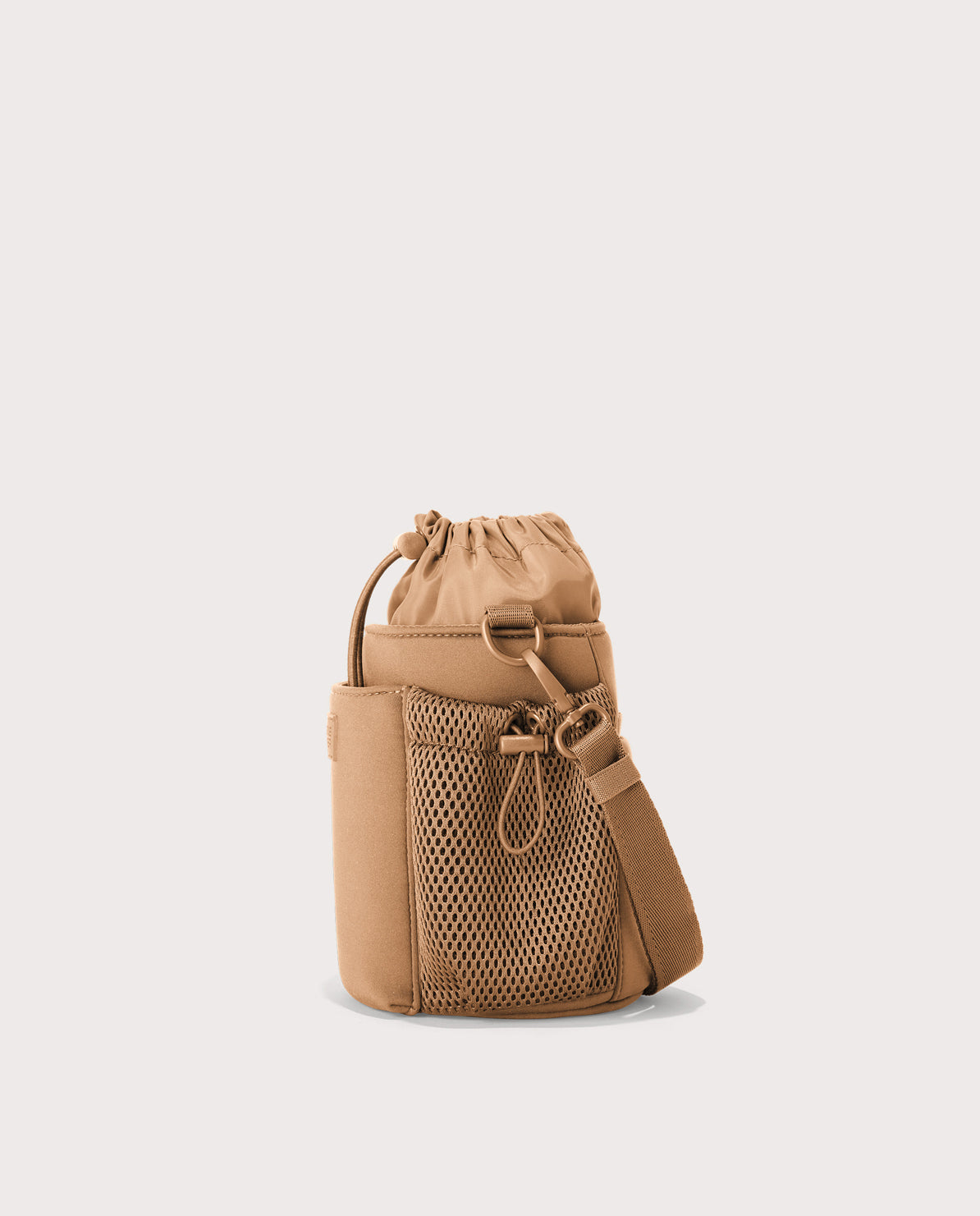 Dagne Dover Sloan Water Bottle Sling in camel brown seen from the side.
