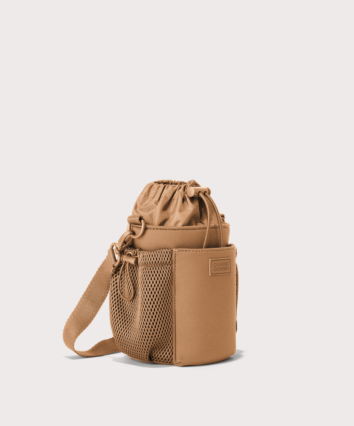 Dagne Dover Sloan Water Bottle Sling in camel brown seen from an angle.
