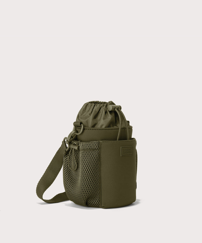 Dagne Dover Sloan Water Bottle Sling in dark green seen from an angle.
