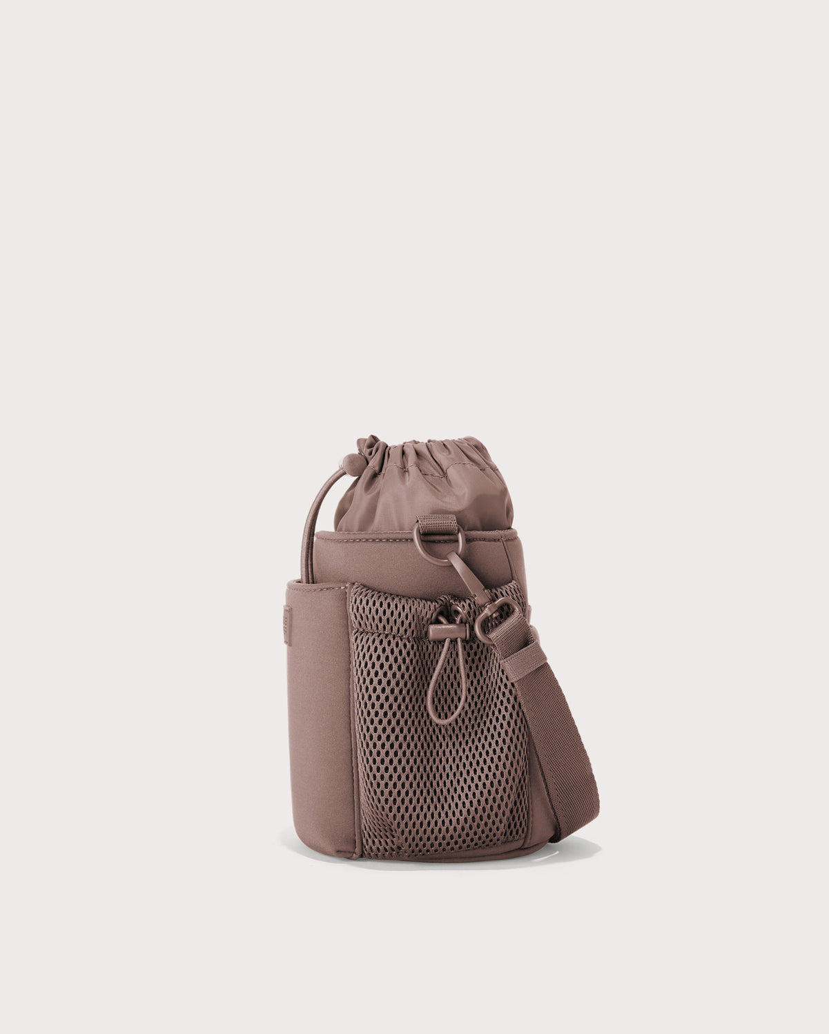 Dagne Dover Sloan Water Bottle Sling in pink seen from an angle.
