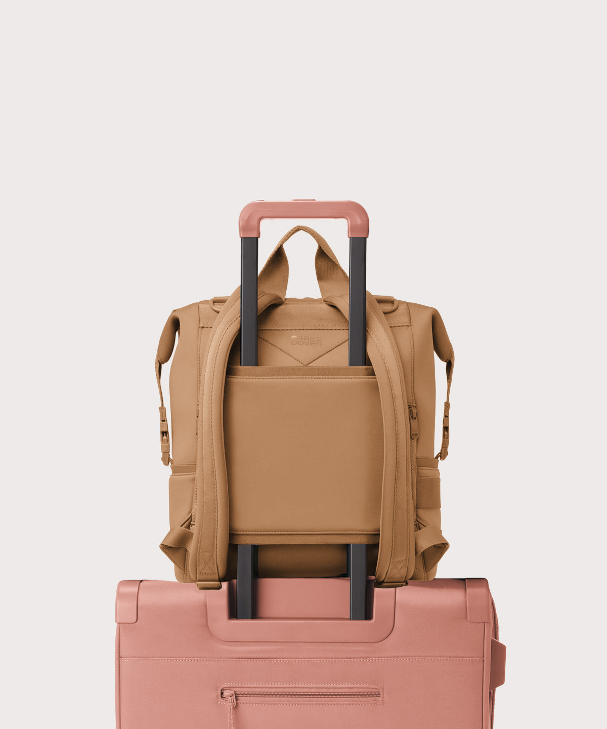 Dagne Dover Large Indi Diaper Backpack in camel brown showing the neoprene luggage sleeve.
