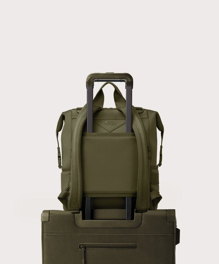 Dagne Dover Large Indi Diaper Backpack in dark moss showing the neoprene luggage sleeve.
