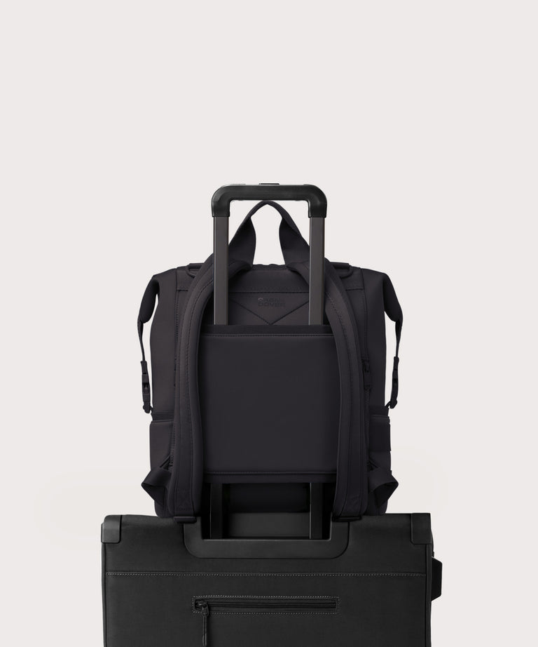 Dagne Dover Large Indi Diaper Backpack in onyx showing the neoprene luggage sleeve.
