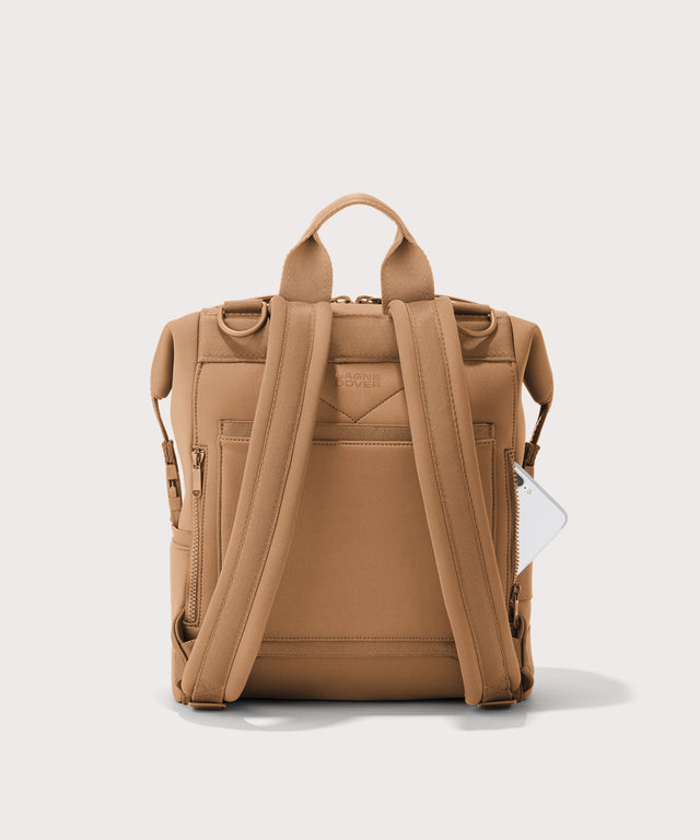 Dagne Dover Medium Indi Diaper Backpack in camel brown seen from the back.
