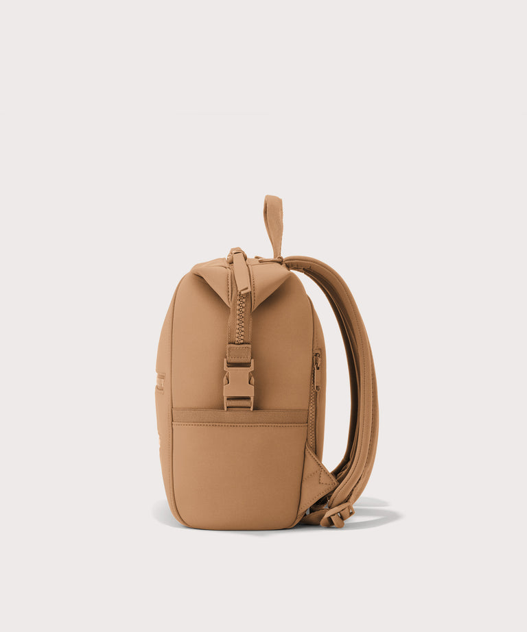 Dagne Dover small Indi Diaper Backpack in camel brown seen from the side.
