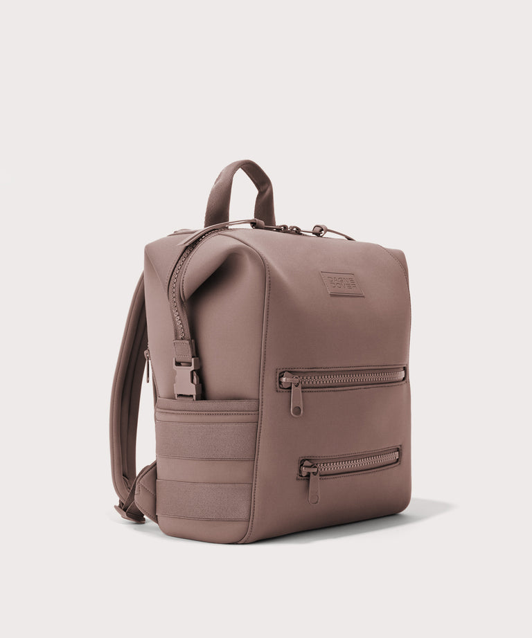 Dagne Dover medium Indi Diaper Backpack in pink seen from an angle.
