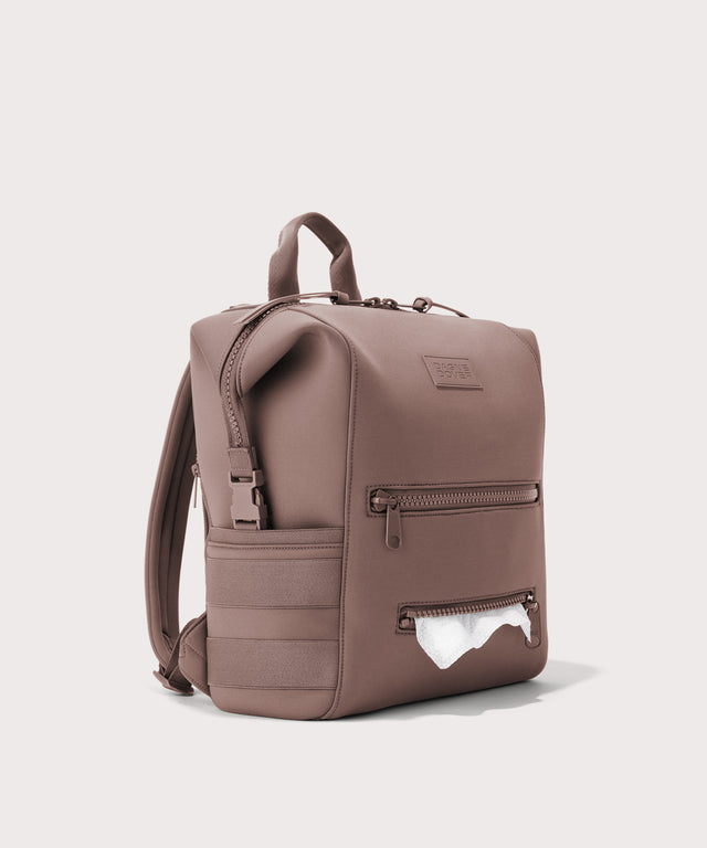 Dagne Dover Medium Indi Diaper Backpack in pink showing the zipper opening for easy access wipes.
