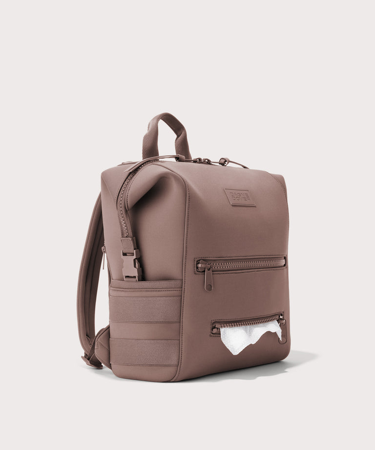 Dagne Dover Medium Indi Diaper Backpack in pink showing the zipper opening for easy access wipes.
