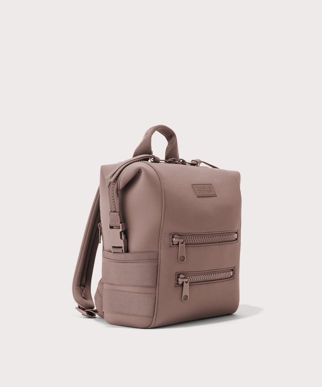 Dagne Dover small Indi Diaper Backpack in pink seen from an angle.
