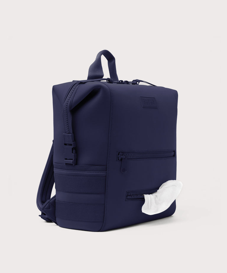 Dagne Dover Large Indi Diaper Backpack in dark blue showing the zipper opening for easy access wipes.
