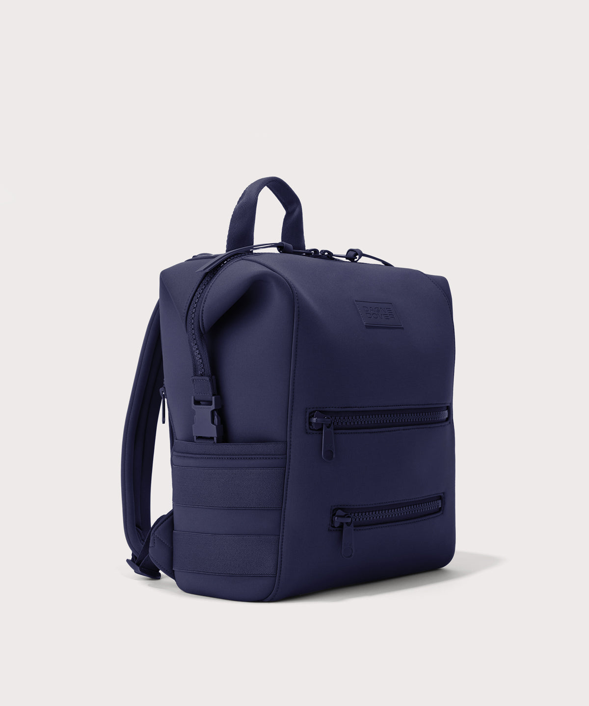 Dagne Dover medium Indi Diaper Backpack in dark blue seen from an angle.
