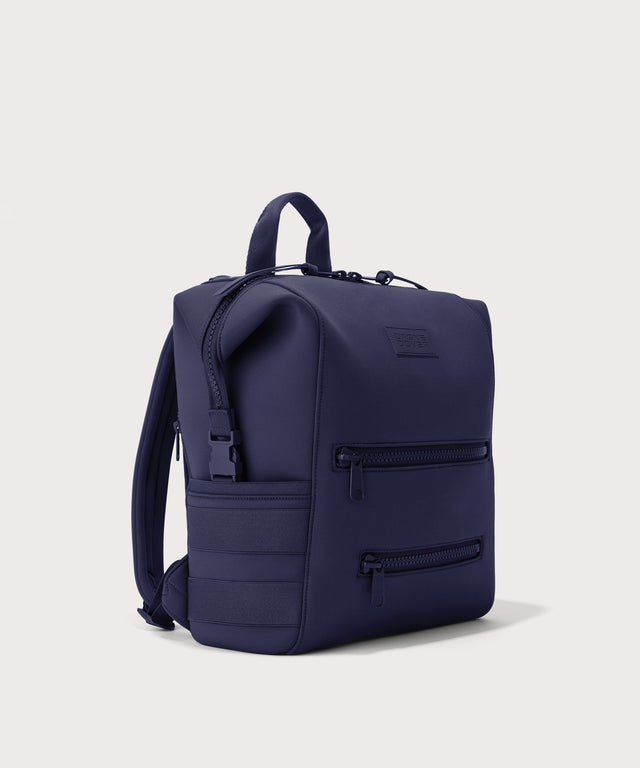 Dagne Dover medium Indi Diaper Backpack in dark blue seen from an angle.
