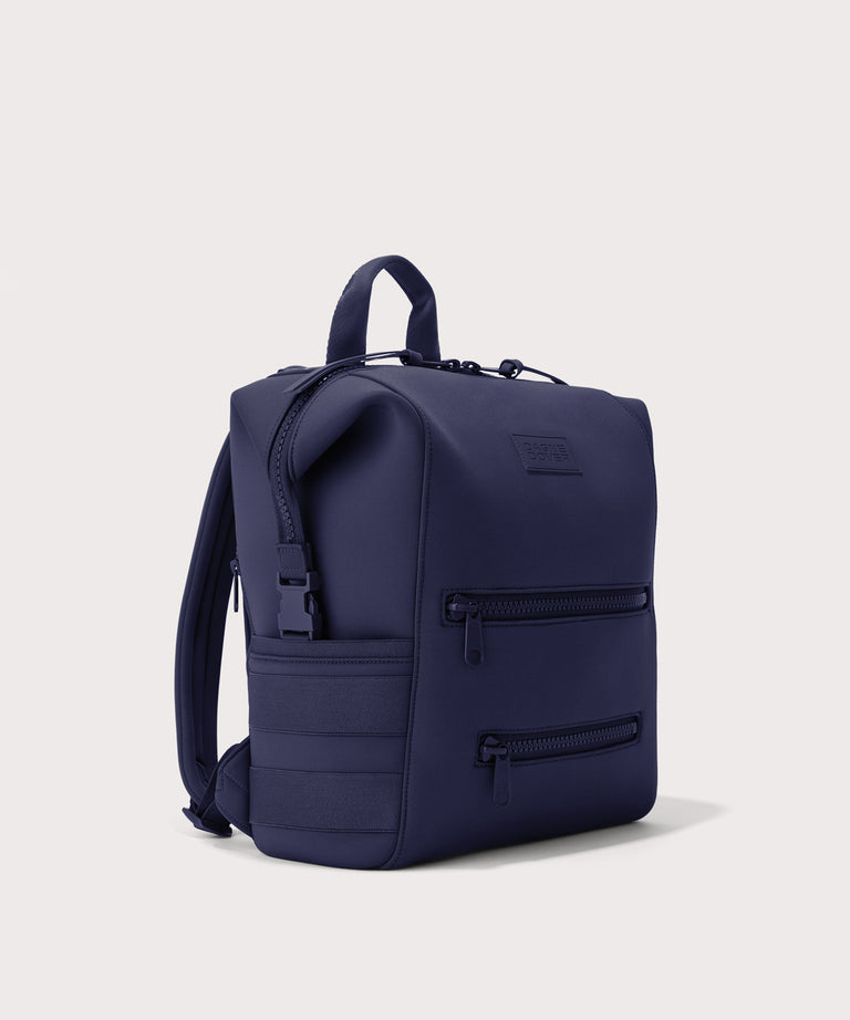 Dagne Dover medium Indi Diaper Backpack in dark blue seen from an angle.
