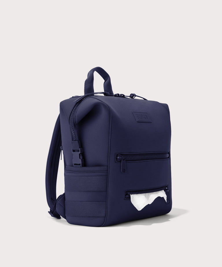 Dagne Dover Medium Indi Diaper Backpack in dark blue showing the zipper opening for easy access wipes.
