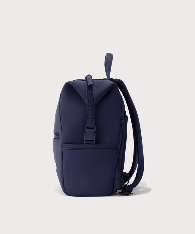 Dagne Dover medium Indi Diaper Backpack in dark blue seen from the side.
