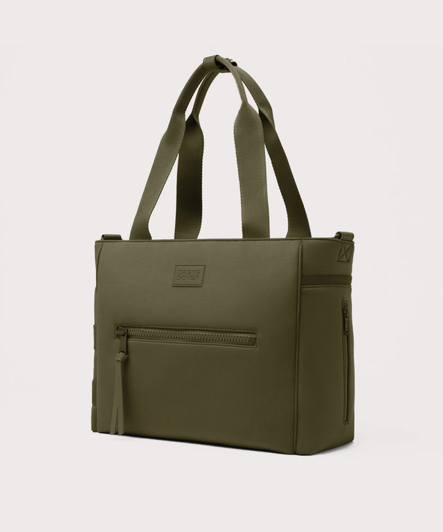 Dagne Dover large Wade Diaper Tote in dark green seen from an angle.
