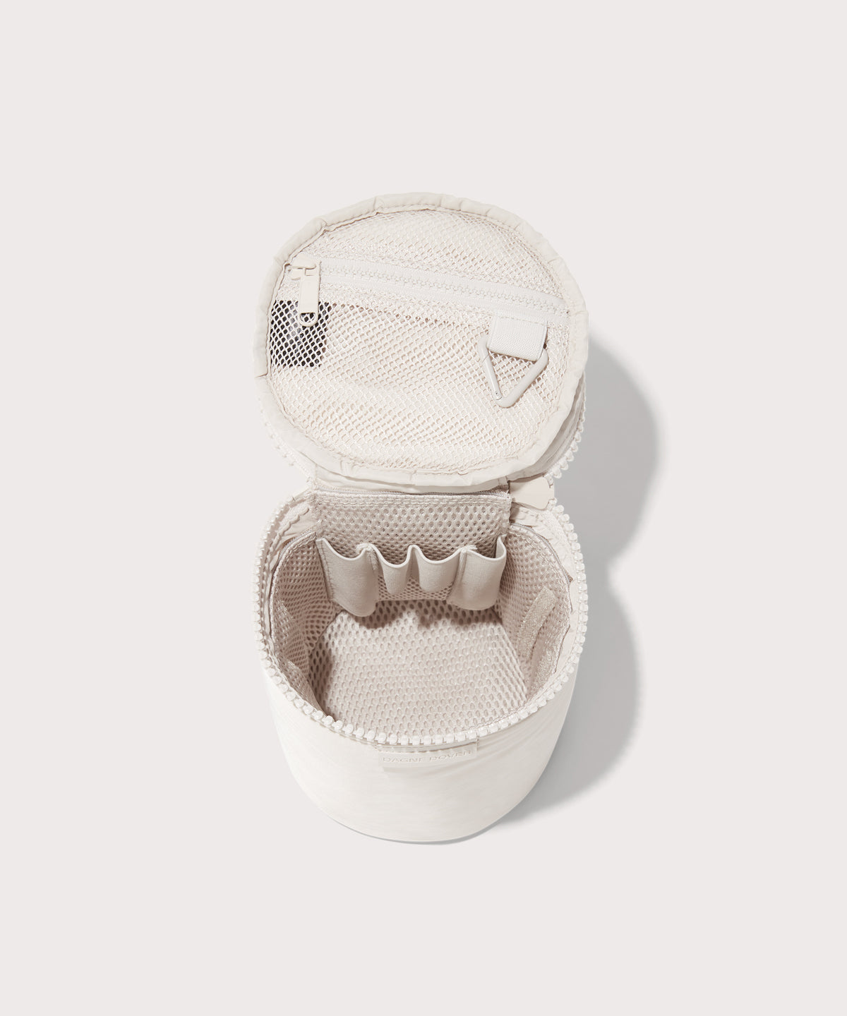 Dagne Dover large Mila Toiletry Pouch in white unzipped with the removable airmesh insert.
