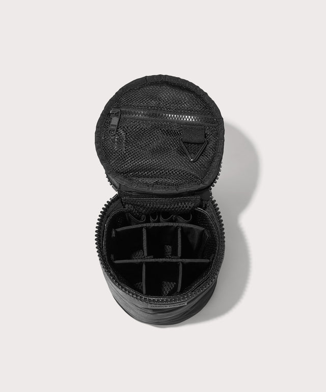 Dagne Dover large Mila Toiletry Pouch in black unzipped with the 6 adjustable compartments.
