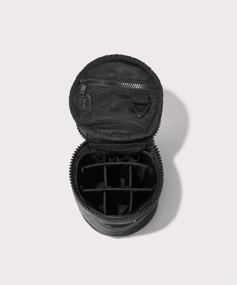 Dagne Dover large Mila Toiletry Pouch in black unzipped with the 6 adjustable compartments.
