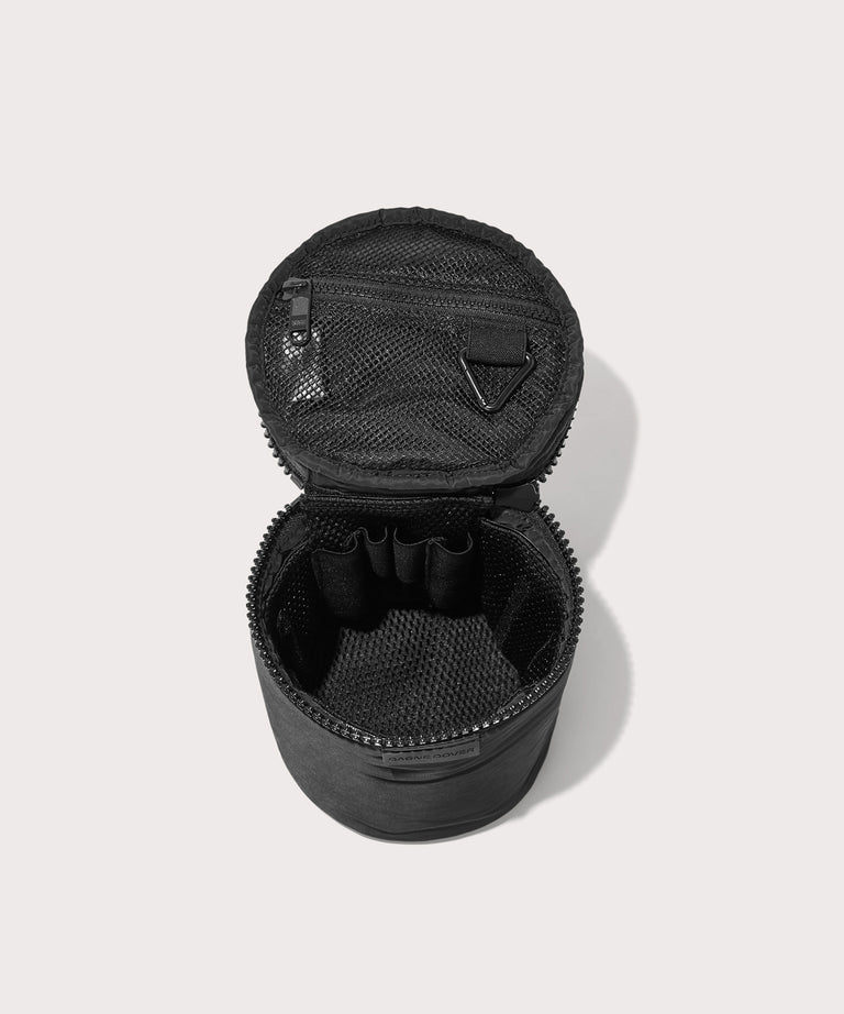 Dagne Dover large Mila Toiletry Pouch in black unzipped with the removable airmesh insert.
