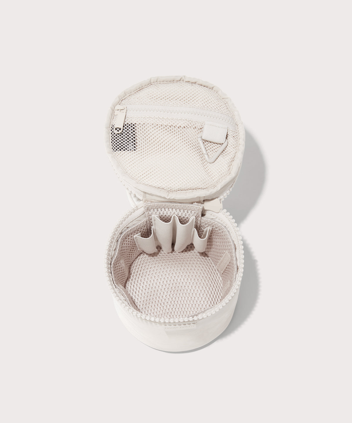 Dagne Dover small Mila Toiletry Pouch in white unzipped with the removable airmesh insert.
