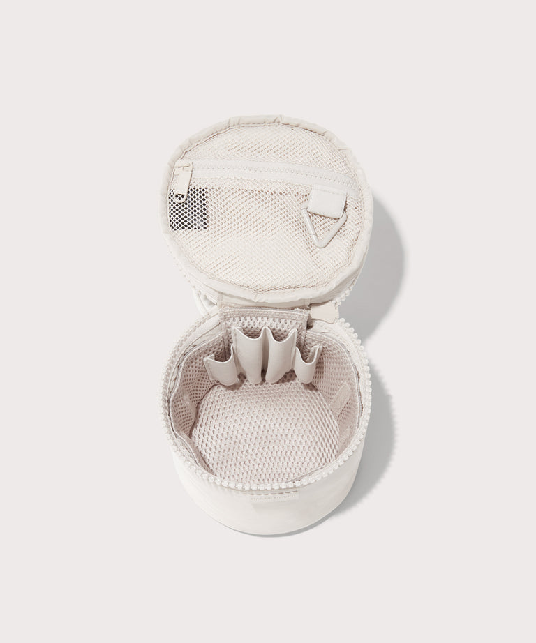 Dagne Dover small Mila Toiletry Pouch in white unzipped with the removable airmesh insert.
