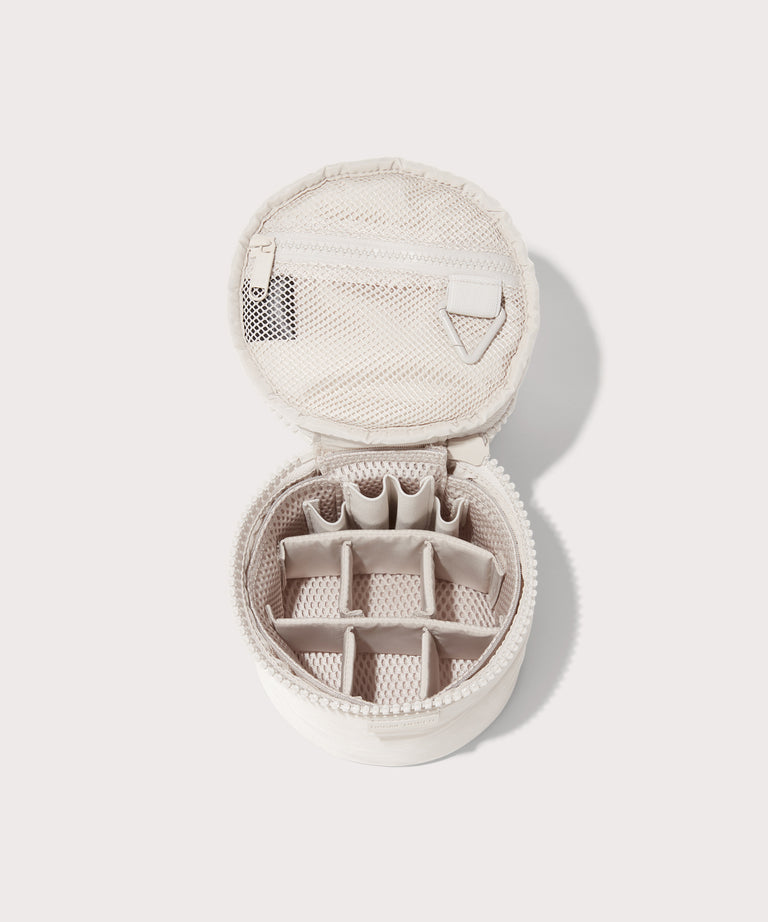 Dagne Dover small Mila Toiletry Pouch in white unzipped with the 6 adjustable compartments.
