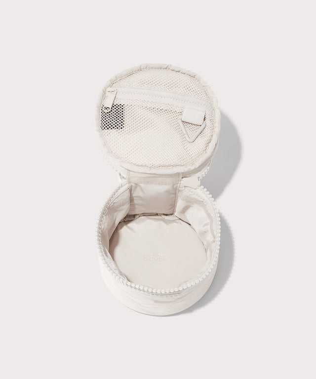 Dagne Dover small Mila Toiletry Pouch in white unzipped.
