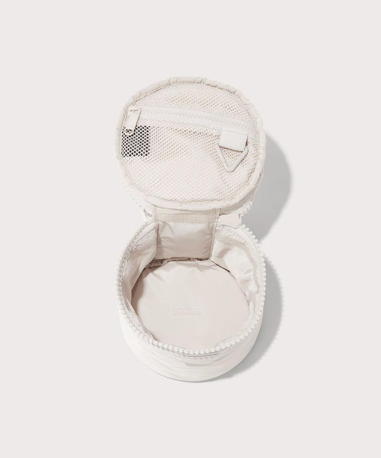 Dagne Dover small Mila Toiletry Pouch in white unzipped.
