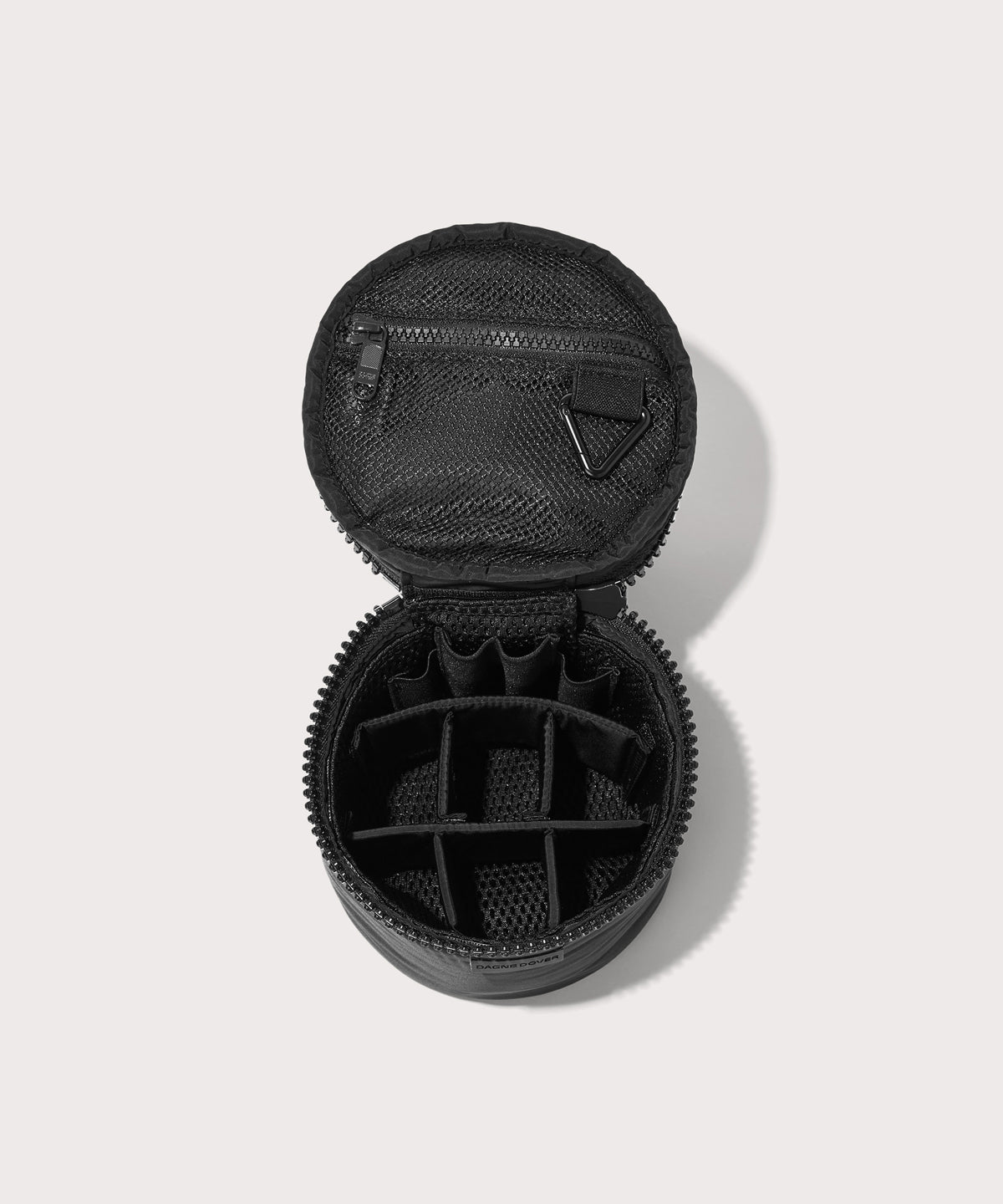 Dagne Dover small Mila Toiletry Pouch in black unzipped with the 6 adjustable compartments.
