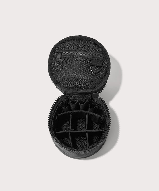 Dagne Dover small Mila Toiletry Pouch in black unzipped with the 6 adjustable compartments.
