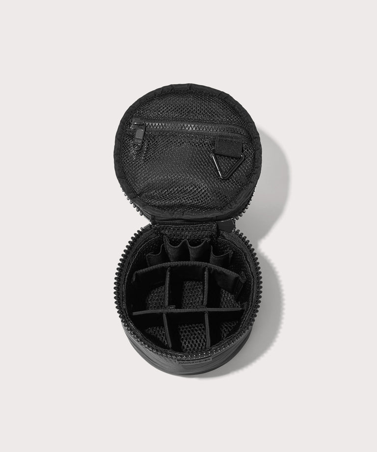 Dagne Dover small Mila Toiletry Pouch in black unzipped with the 6 adjustable compartments.

