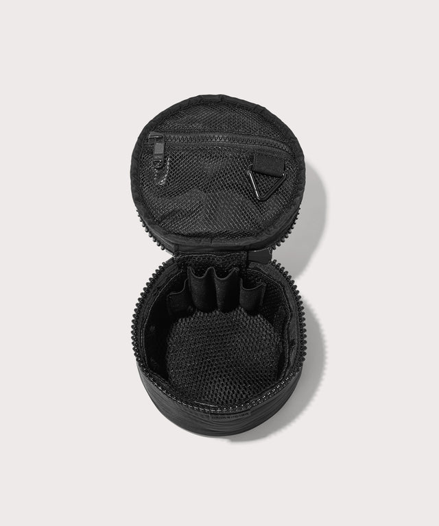 Dagne Dover small Mila Toiletry Pouch in black unzipped with the removable airmesh insert.
