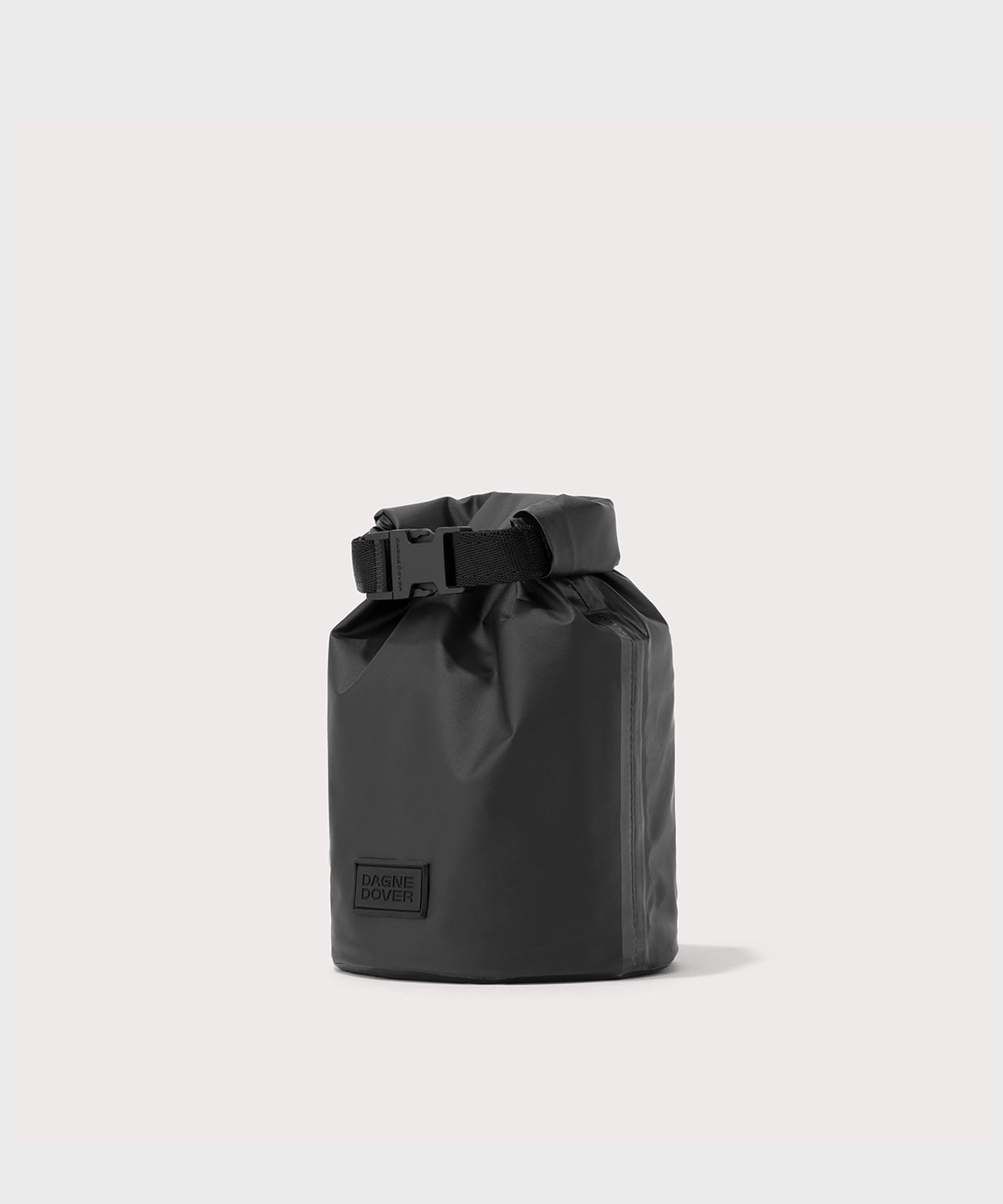 Dagne Dover Rae Roll-Top Dry Bag in black seen from an angle.

