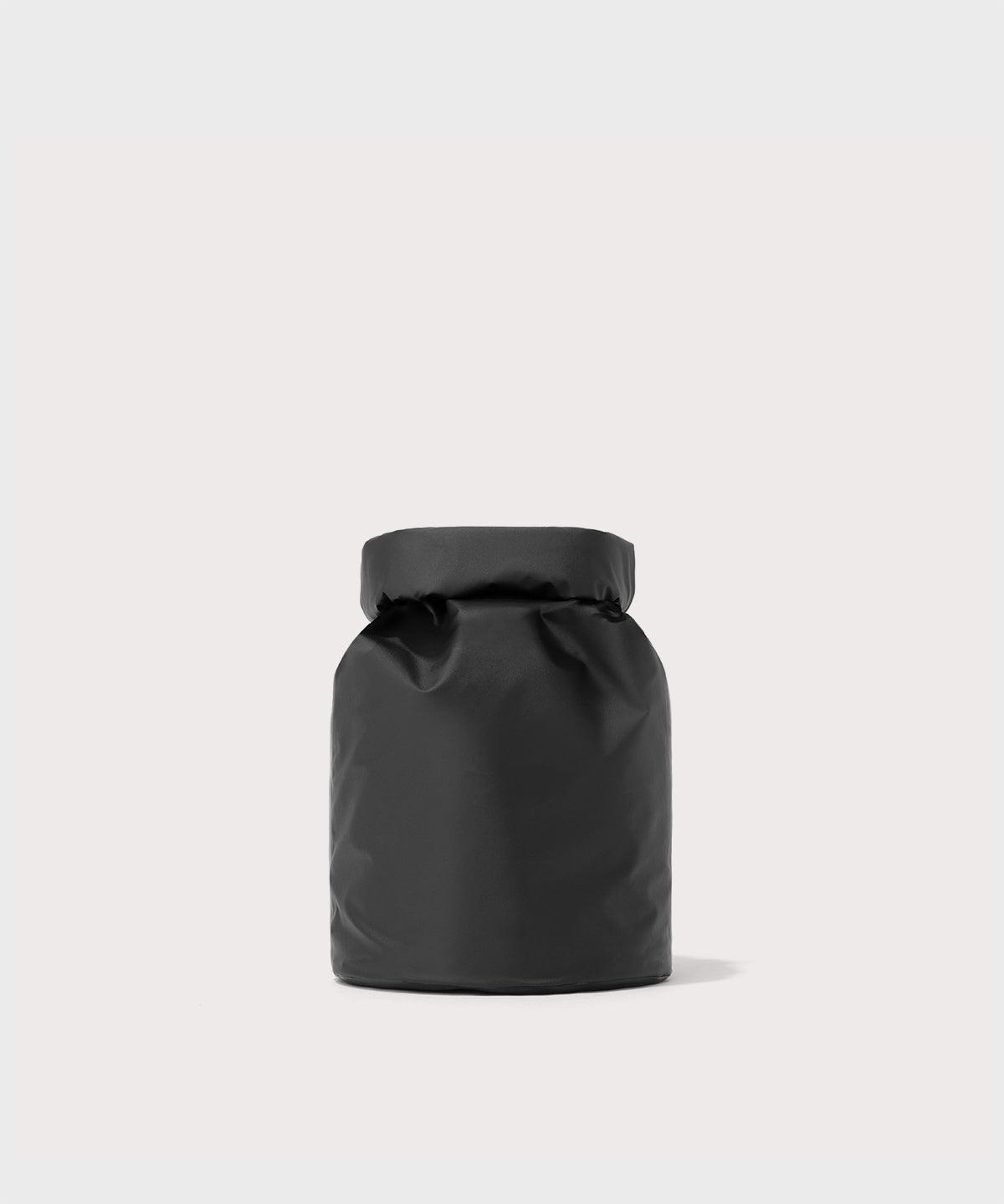 Dagne Dover Rae Roll-Top Dry Bag in black seen from the back.
