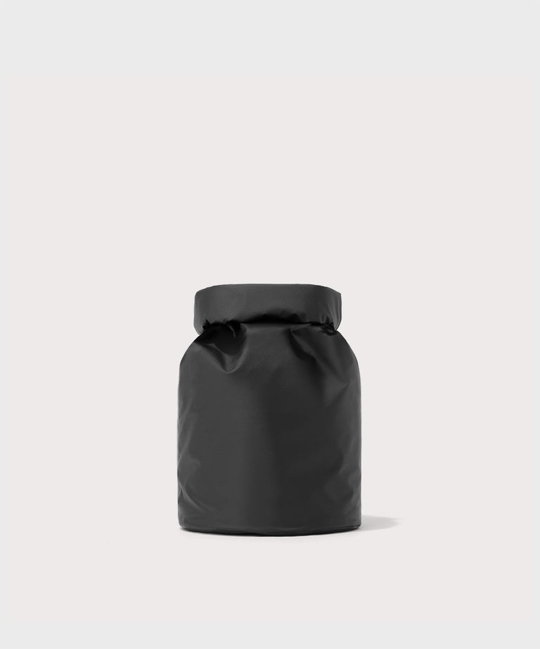 Dagne Dover Rae Roll-Top Dry Bag in black seen from the back.
