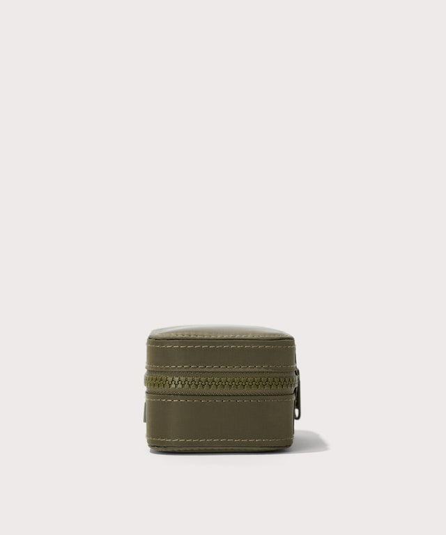 Dagne Dover small Frankie Jewelry Case in dark green seen from a side.

