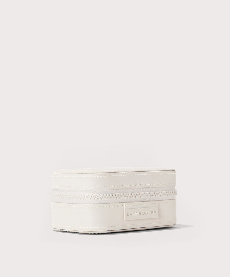 Dagne Dover small Frankie Jewelry Case in white seen from an angle.
