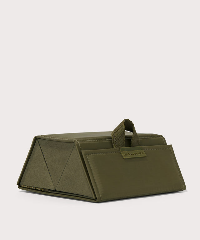 Dagne Dover Remi foldable glasses holder in dark green seen from an angle.
